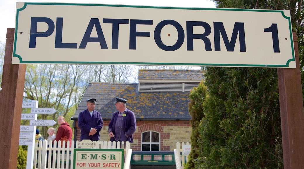 Eastbourne Miniature Steam Railway Adventure Park showing railway items and signage as well as a small group of people