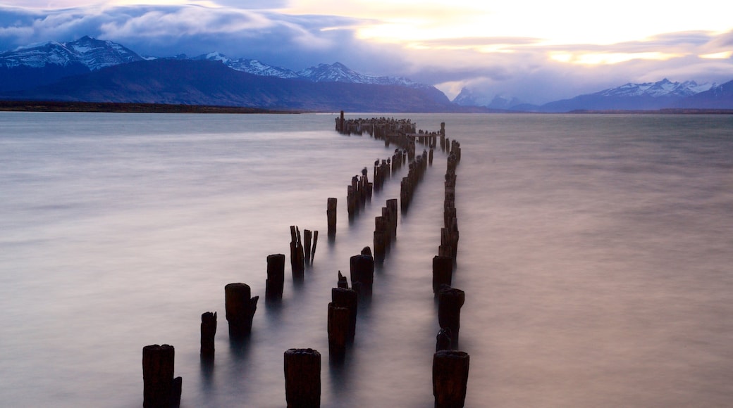 Puerto Natales showing landscape views, a lake or waterhole and a sunset