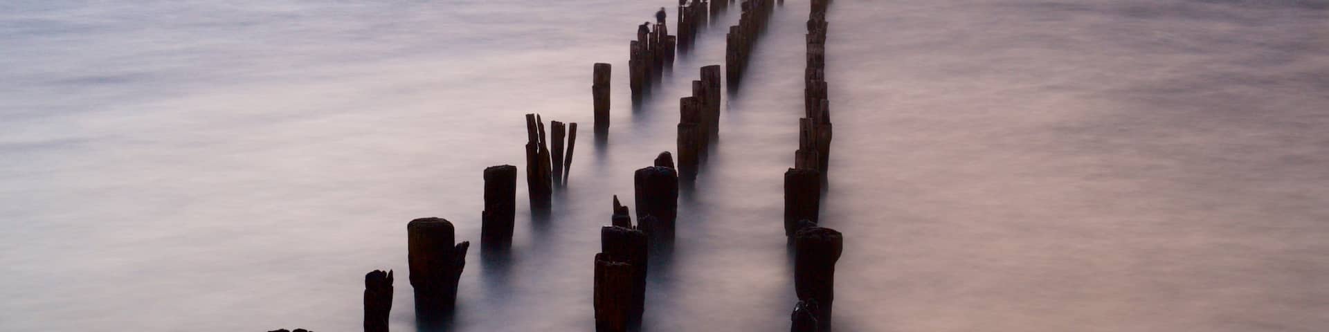 Puerto Natales which includes landscape views, a sunset and a lake or waterhole