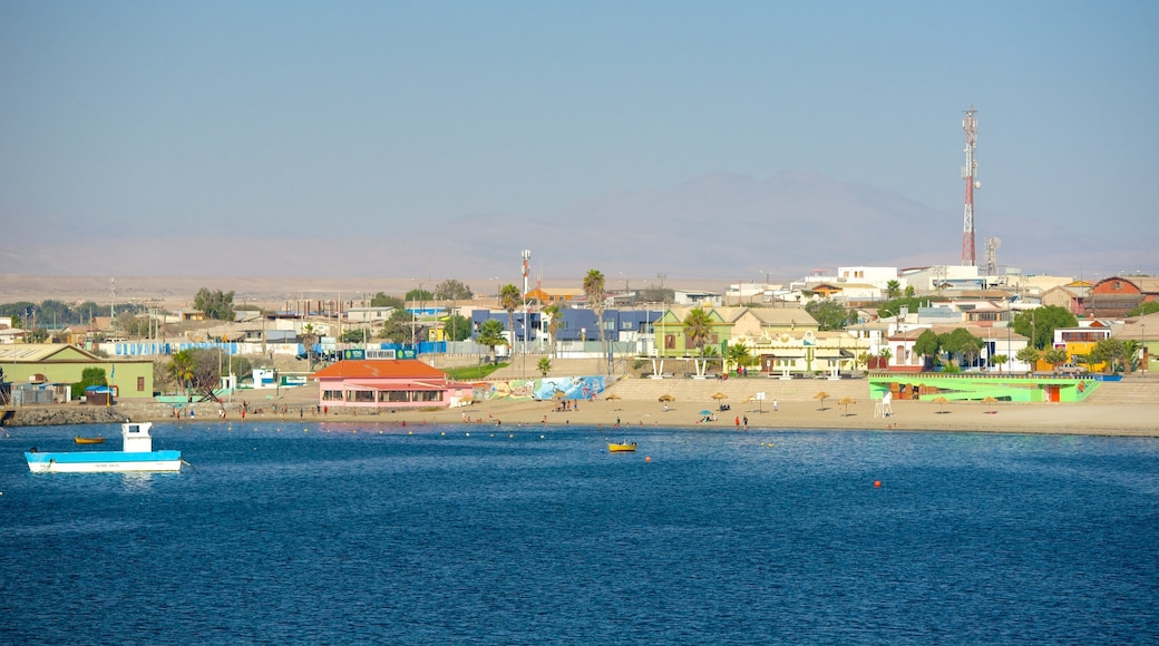 Caldera Beach showing a beach and a coastal town