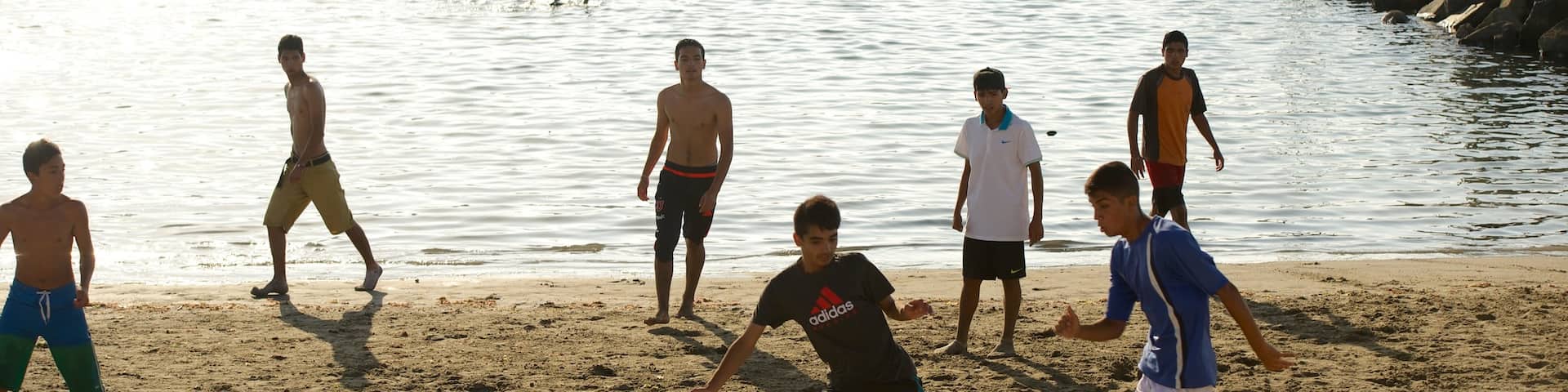 Caldera Beach which includes a beach as well as a small group of people