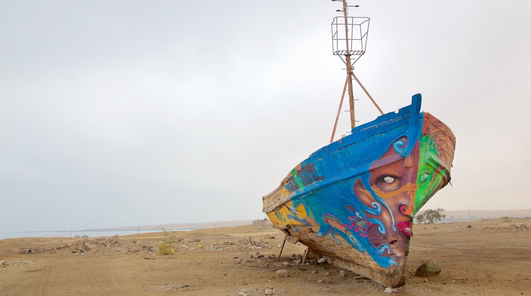 Caldera showing outdoor art and a beach