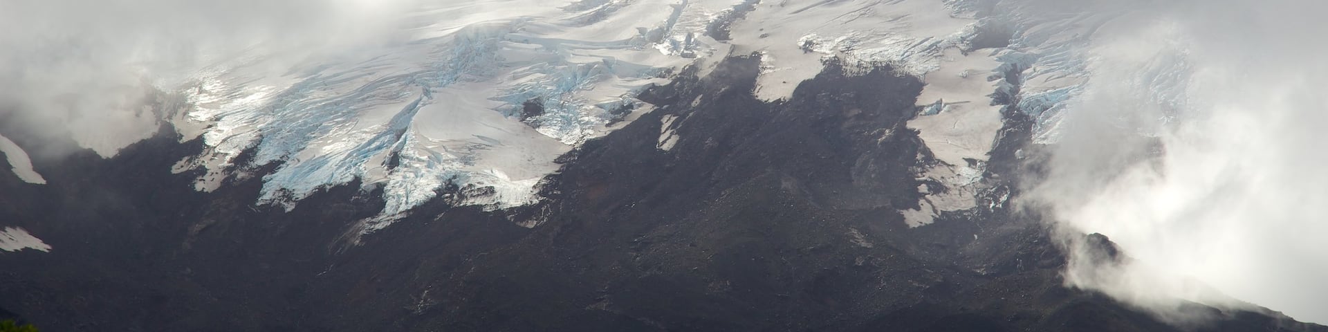 Osorno Volcano Peak which includes mist or fog, mountains and snow