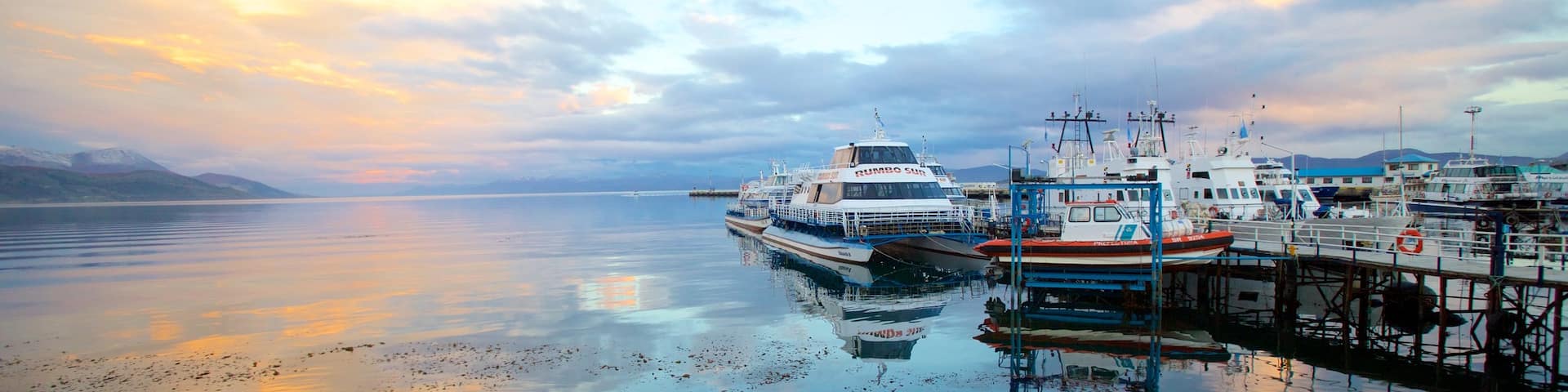 Ushuaia showing a marina, a lake or waterhole and a sunset