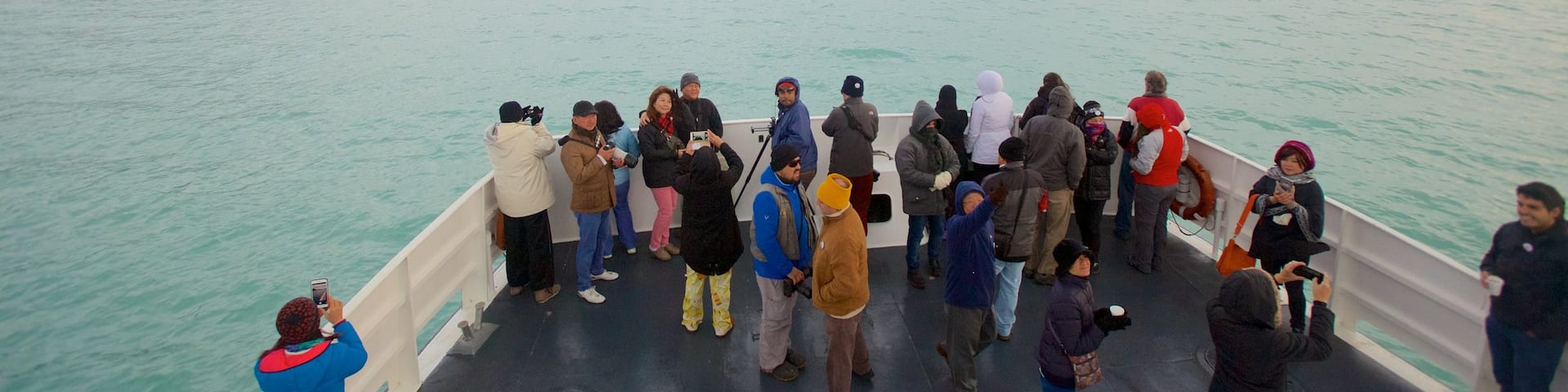 Canal Upsala which includes a lake or waterhole as well as a small group of people