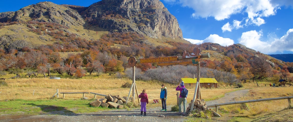Los Glaciares National Park showing mountains and tranquil scenes as well as a small group of people