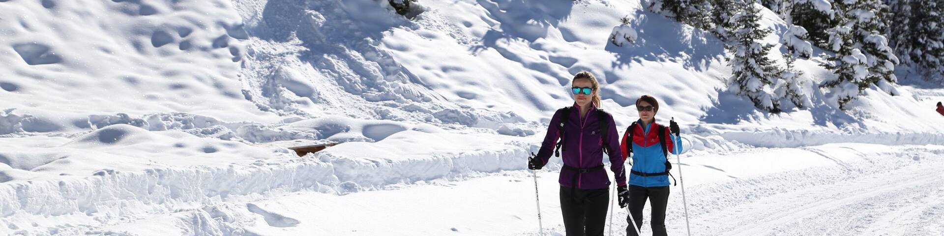 Meribel Ski Resort featuring snow and snow skiing as well as a small group of people