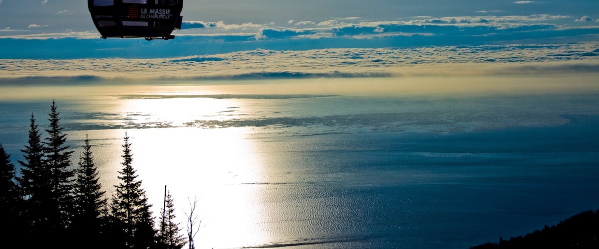 Le Massif de Charlevoix featuring a gondola and a river or creek