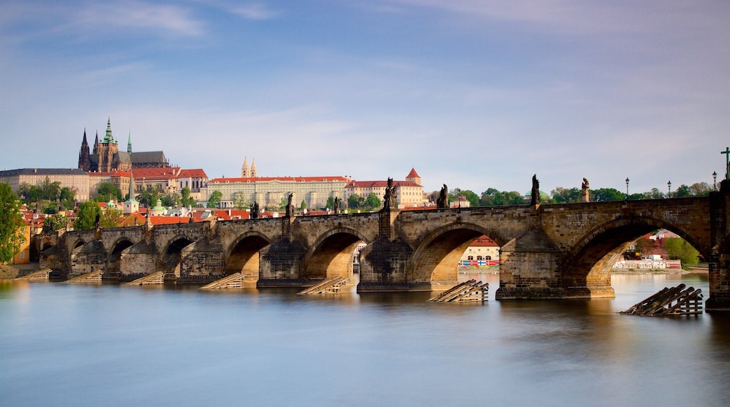 Charles Bridge which includes a bridge, a city and a river or creek