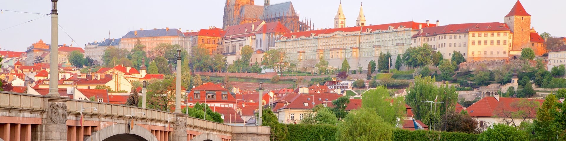 Prague Castle showing a city, a river or creek and a bridge