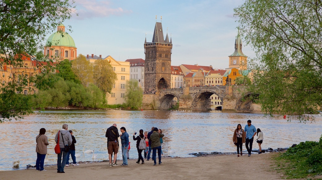 Old Town Bridge Tower showing a river or creek, a bridge and a city