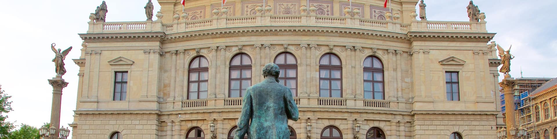 Rudolfinum showing a statue or sculpture, a city and heritage elements