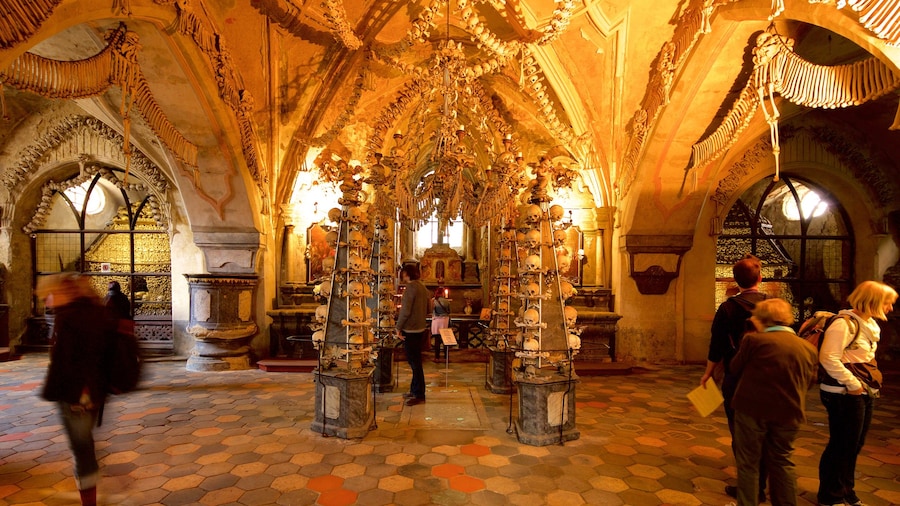 Sedlec Ossuary which includes heritage elements and interior views as well as a small group of people