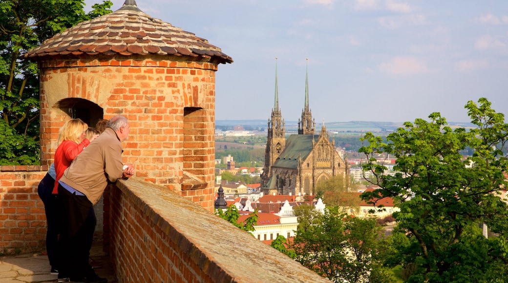 Spilberk Castle showing views and a city as well as a small group of people