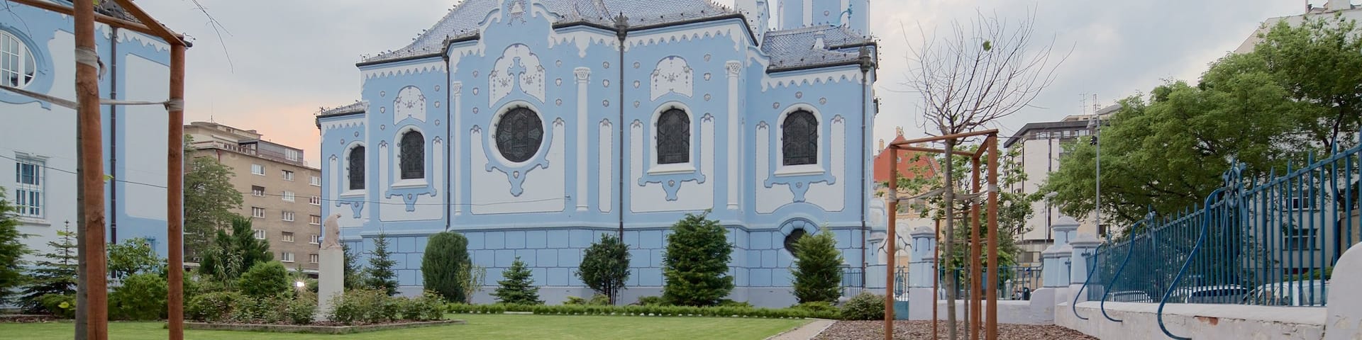Blue Church featuring a church or cathedral and a garden