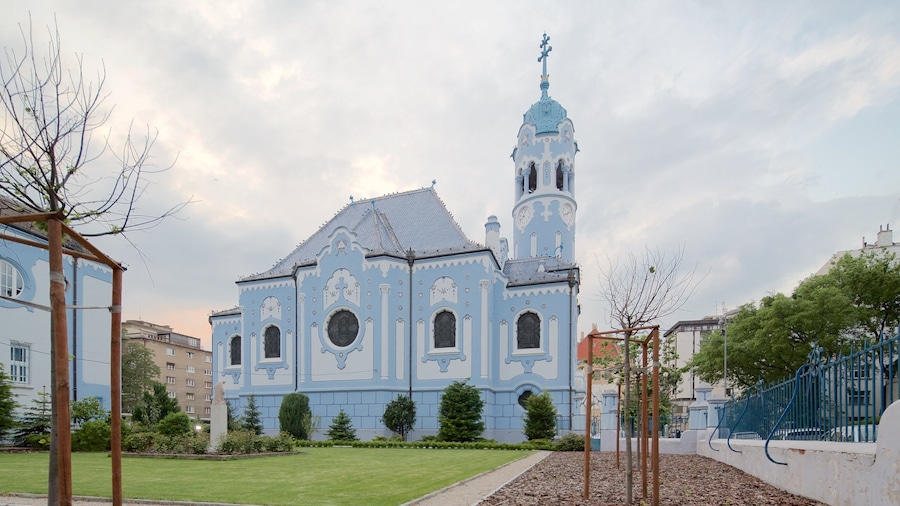 Blue Church featuring a church or cathedral and a garden