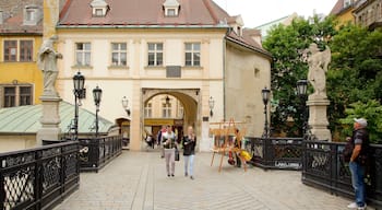 Michael\'s Gate showing street scenes and a city as well as a couple