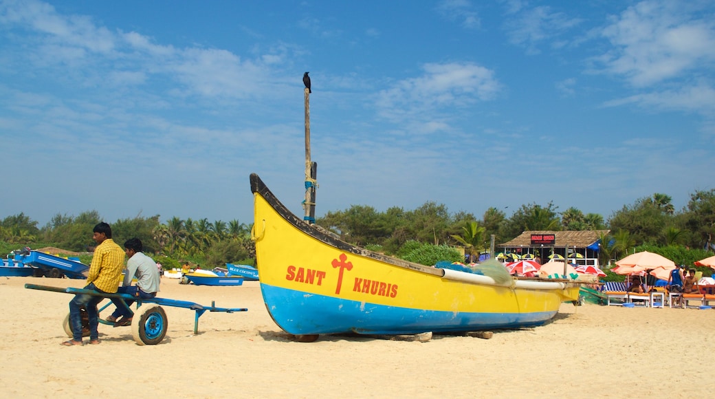 Calangute Beach showing general coastal views and a beach as well as a small group of people