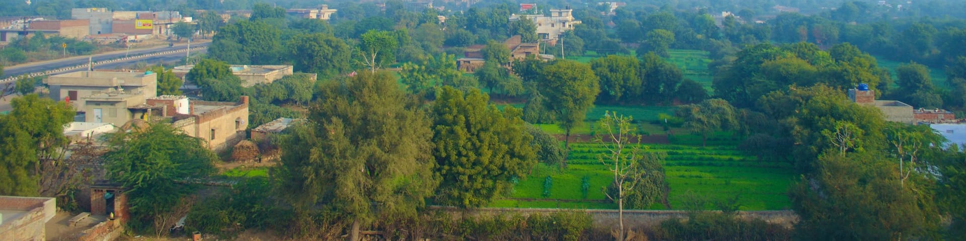 Jaipur which includes mountains, farmland and a small town or village