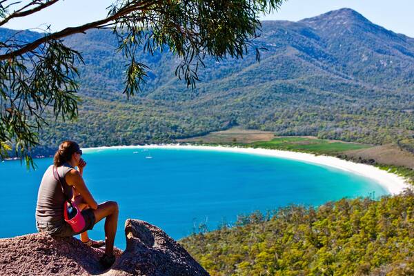 Freycinet showing general coastal views and mountains as well as an individual female