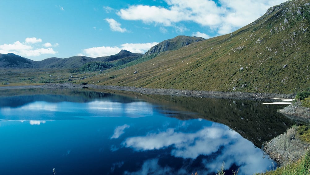 Zeehan showing a lake or waterhole and mountains