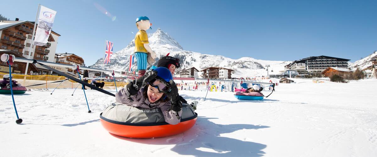 Galtur featuring a luxury hotel or resort and snow as well as an individual child