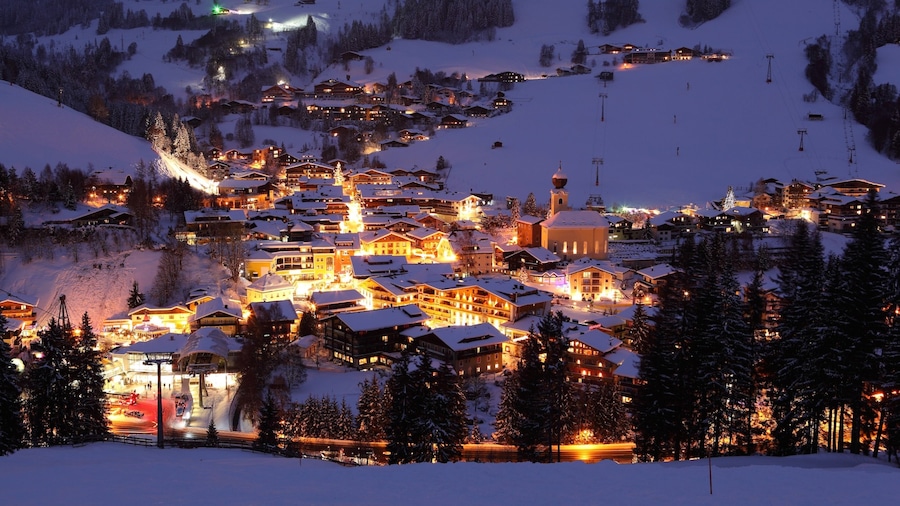 Saalbach-Hinterglemm Ski Resort which includes night scenes, a small town or village and snow