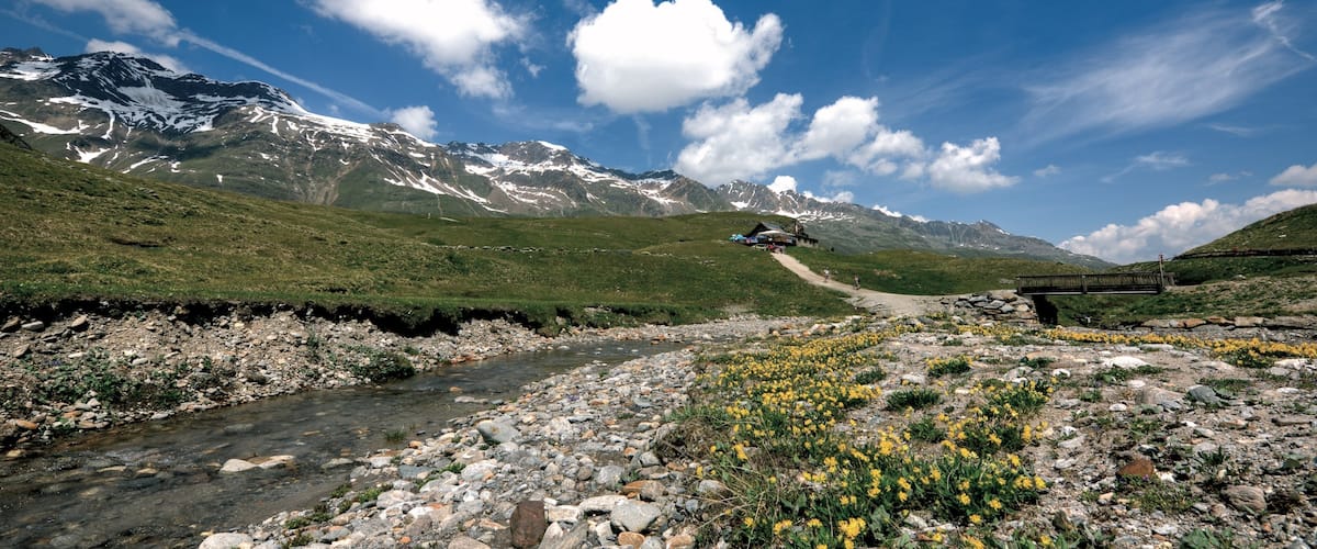 Obergurgl which includes mountains, farmland and a river or creek
