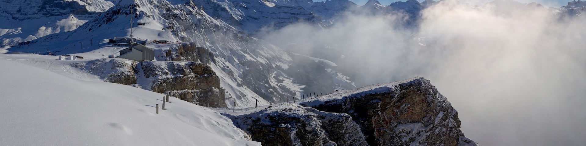 Bernese Alps which includes mist or fog, snow and mountains