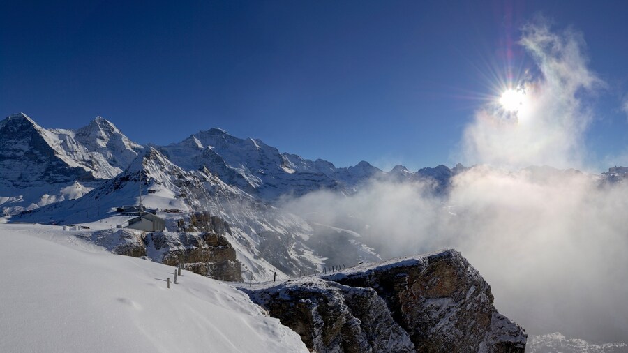 Bernese Alps which includes mist or fog, snow and mountains