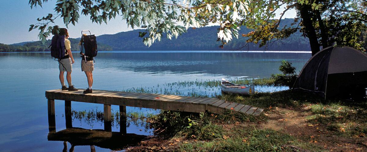Hot Springs featuring camping and a lake or waterhole as well as a couple