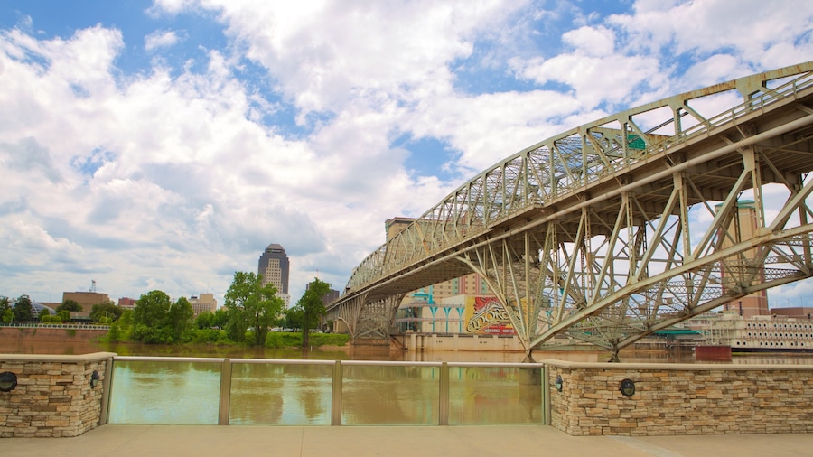 Louisiana Boardwalk showing a river or creek and a bridge