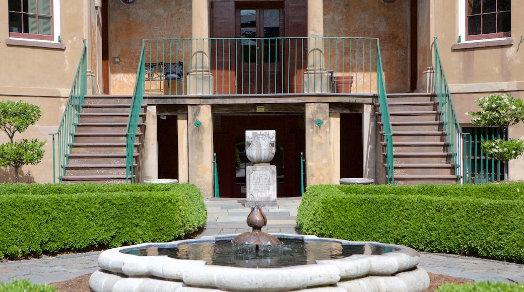 Owens-Thomas House featuring a garden and a fountain