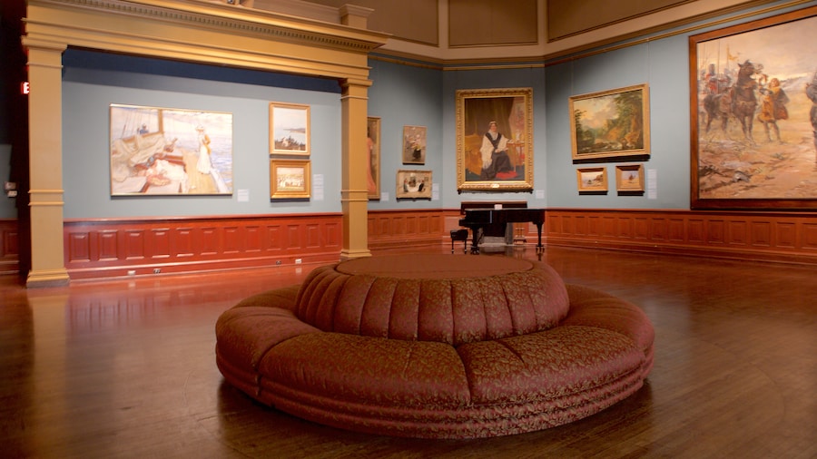 Interior of the Telfair Academy in Savannah, Georgia, featuring classic paintings, ornate architectural details, and elegant gallery seating