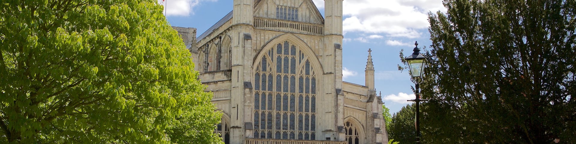 Winchester Cathedral which includes a garden, a church or cathedral and religious elements