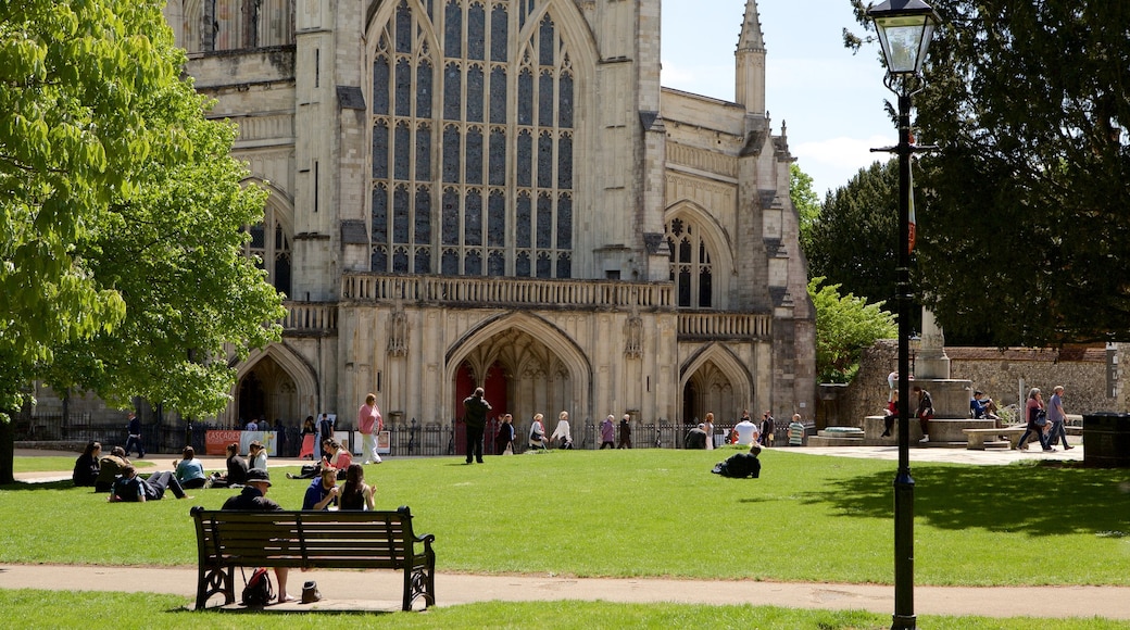 Winchester Cathedral featuring heritage architecture, a garden and religious elements