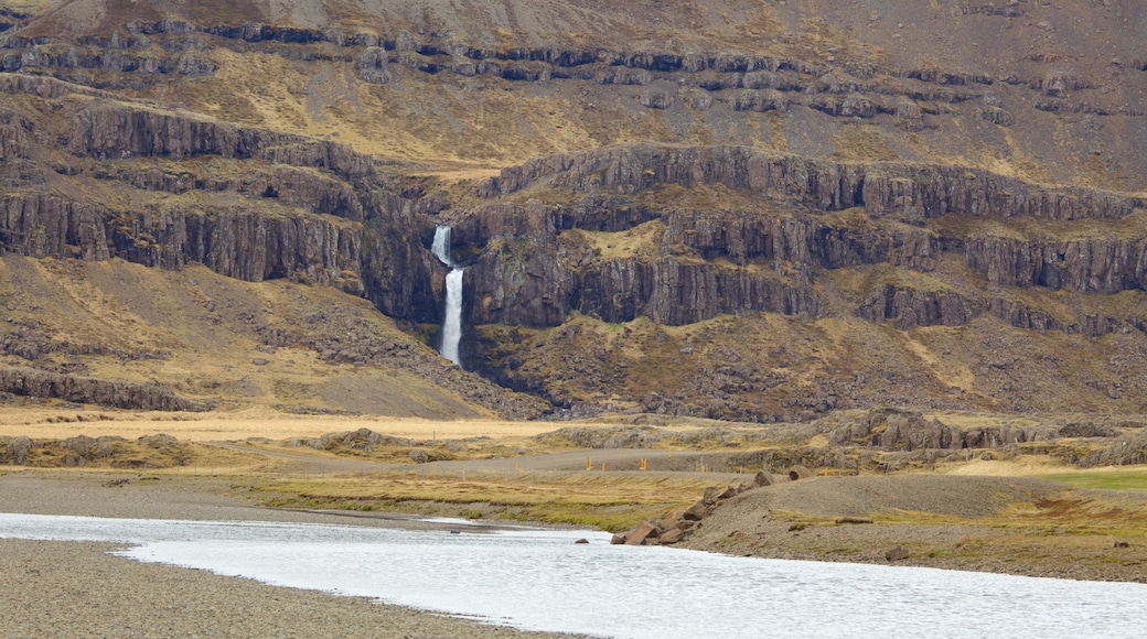 East Iceland featuring a cascade, mountains and general coastal views