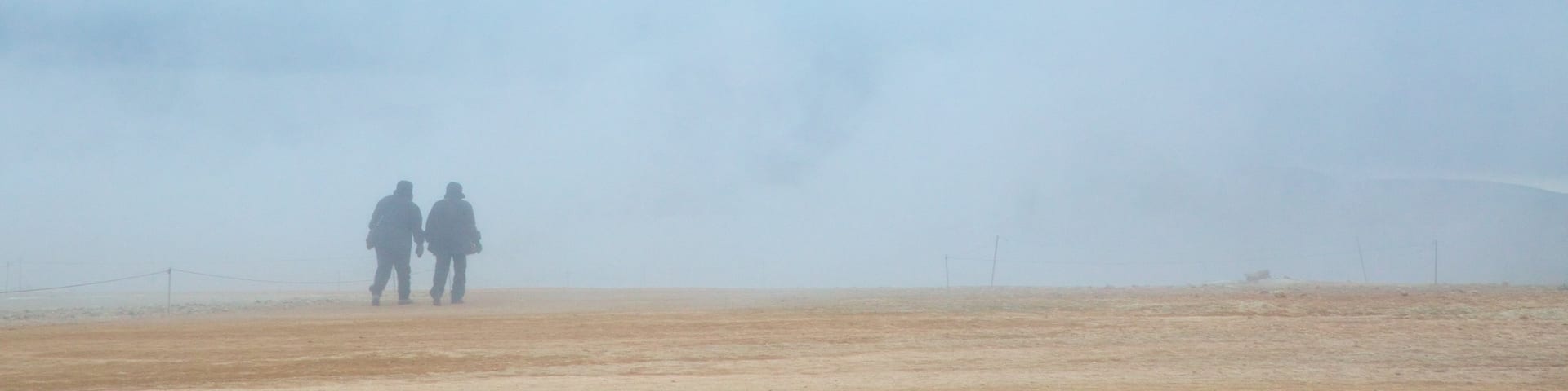 Namafjall featuring mist or fog as well as a couple