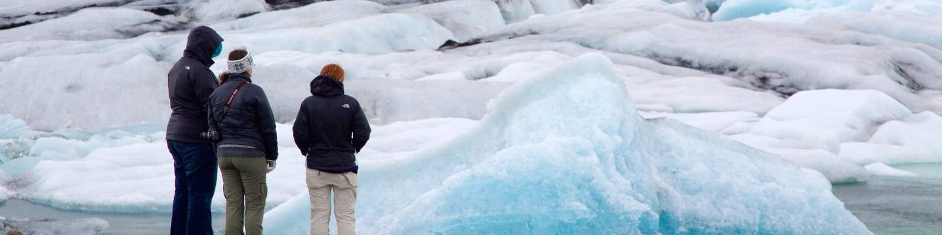 Jokulsarlon Lagoon which includes snow as well as a small group of people