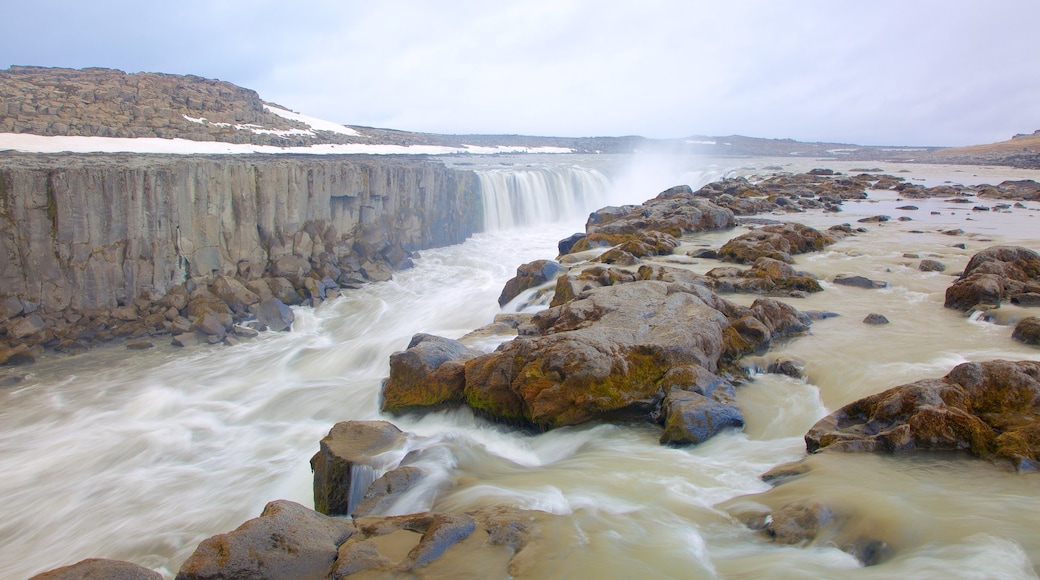 Selfoss featuring rapids, a gorge or canyon and snow