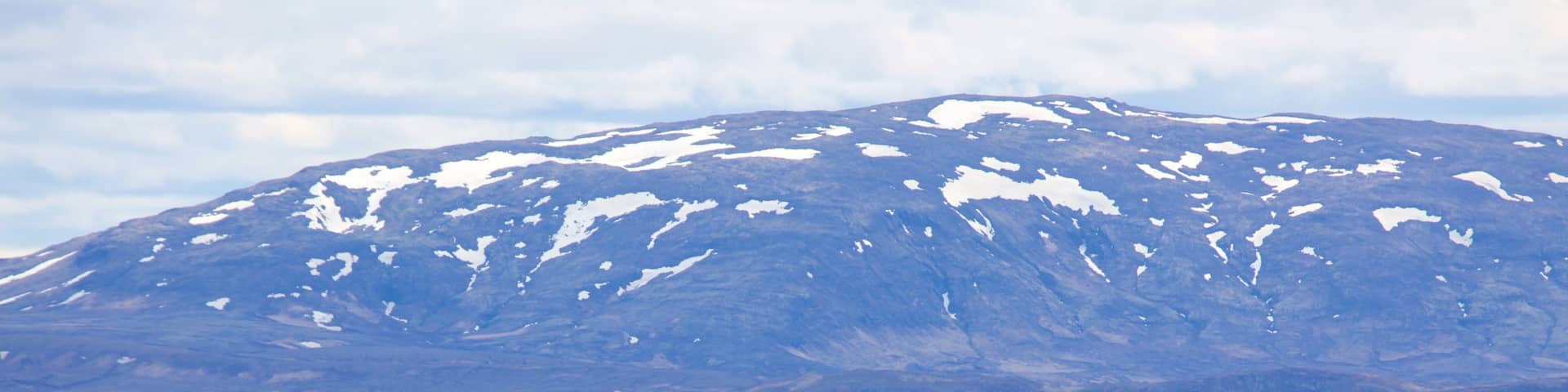 Thingvellir National Park which includes snow, mountains and general coastal views