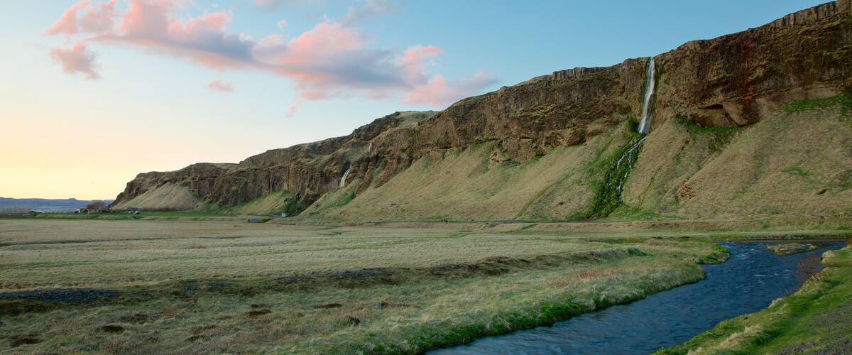 Seljalandsfoss featuring a river or creek, tranquil scenes and mountains