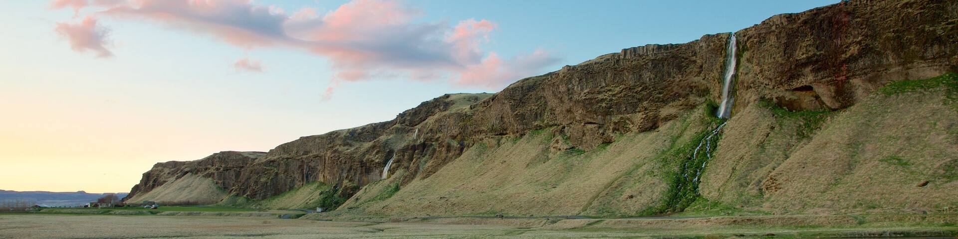 Seljalandsfoss which includes a river or creek, mountains and tranquil scenes