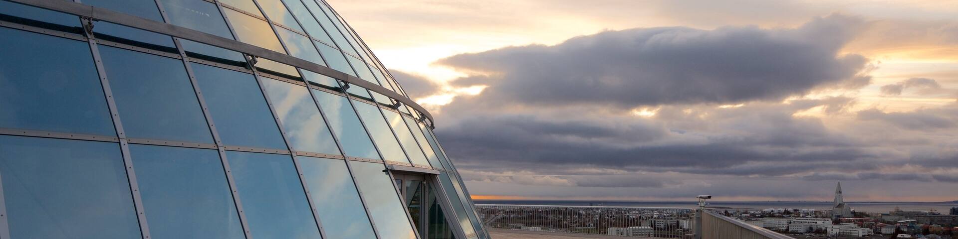 Perlan showing modern architecture and a sunset