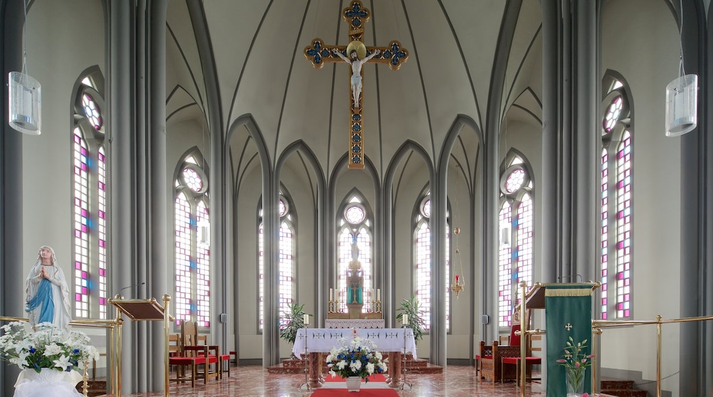 Landakotskirkja featuring a church or cathedral, interior views and religious elements