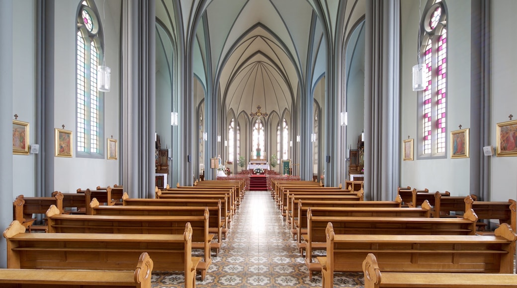 Landakotskirkja featuring interior views and a church or cathedral