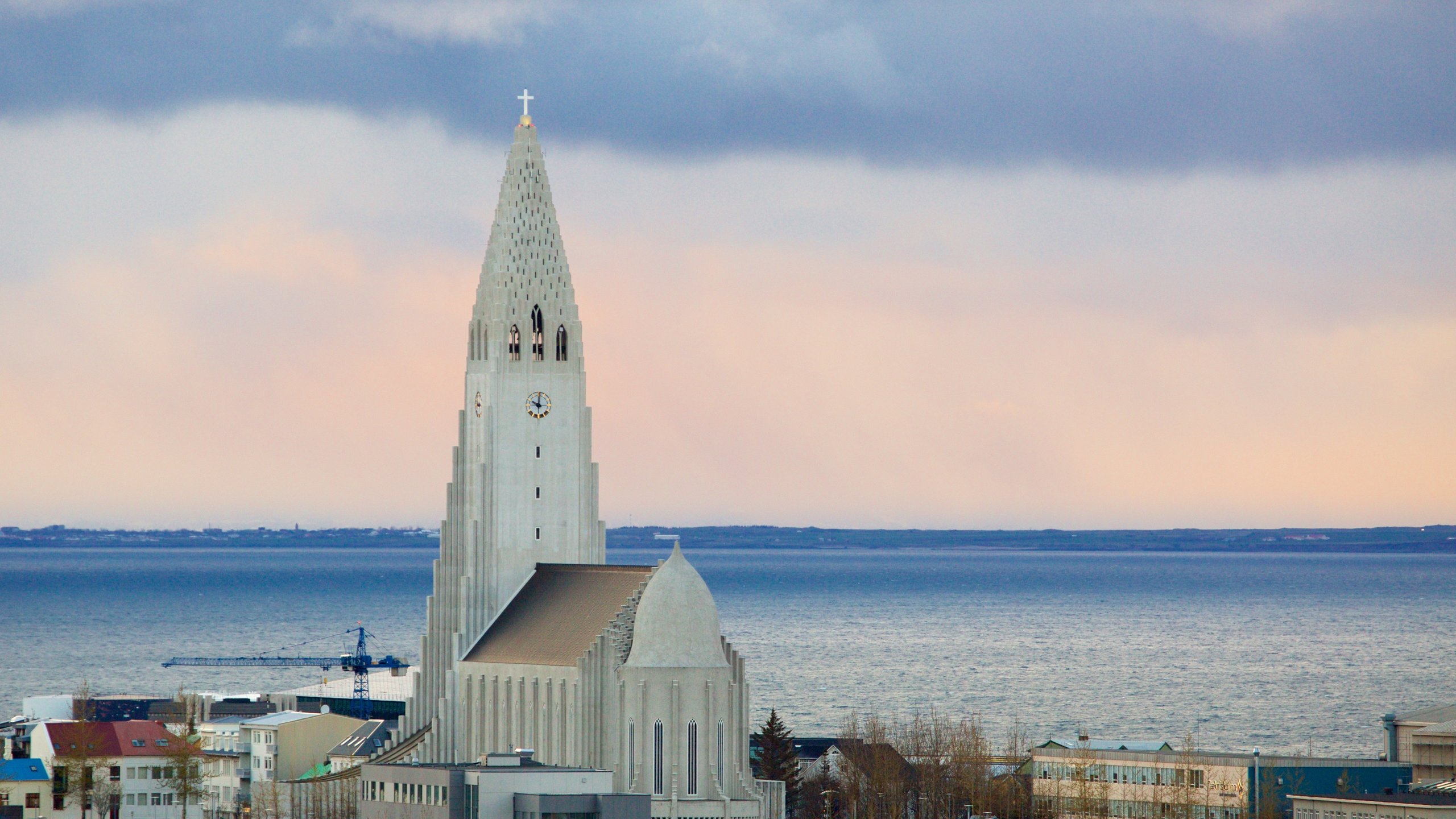 Hallgrimskirkja featuring general coastal views, a church or cathedral and a sunset