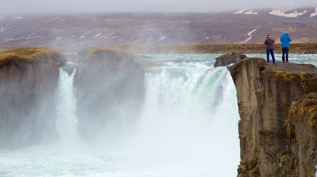 Godafoss featuring mist or fog and a waterfall