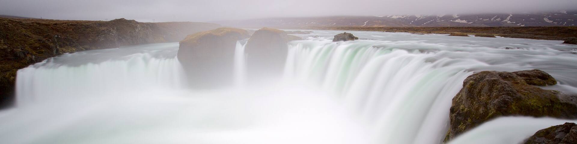 Godafoss featuring a cascade and mist or fog