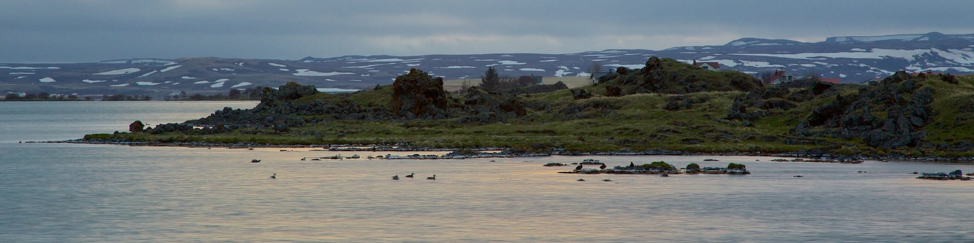 Myvatn showing a lake or waterhole and a sunset
